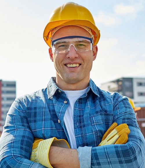 Construction worker on site with protective headwear